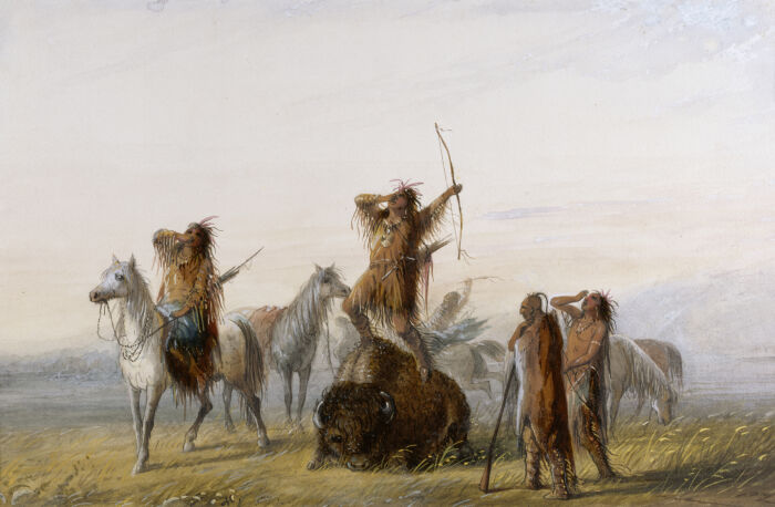 Pintura del siglo XIX en la que los cazadores nativos americanos se renen en torno a un bfalo herido de muerte y lanzan un grito de victoria antes de dar el golpe de gracia al animal