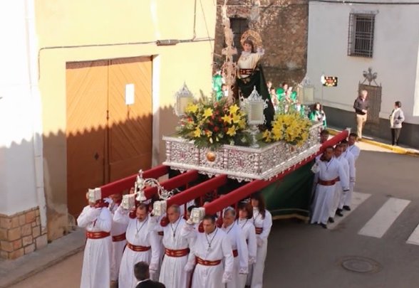 Anderos que sostienen una imagen religiosa