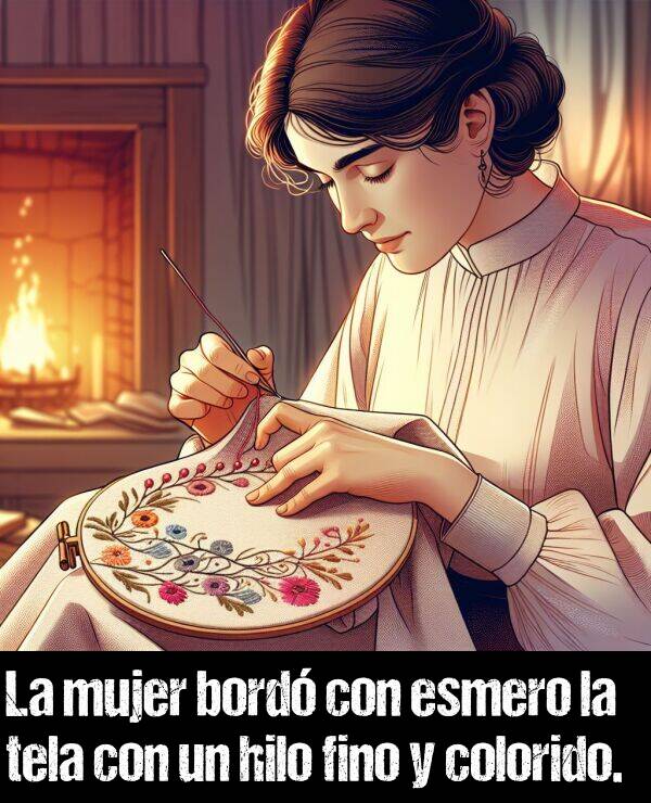 bord: La mujer bord con esmero la tela con un hilo fino y colorido.